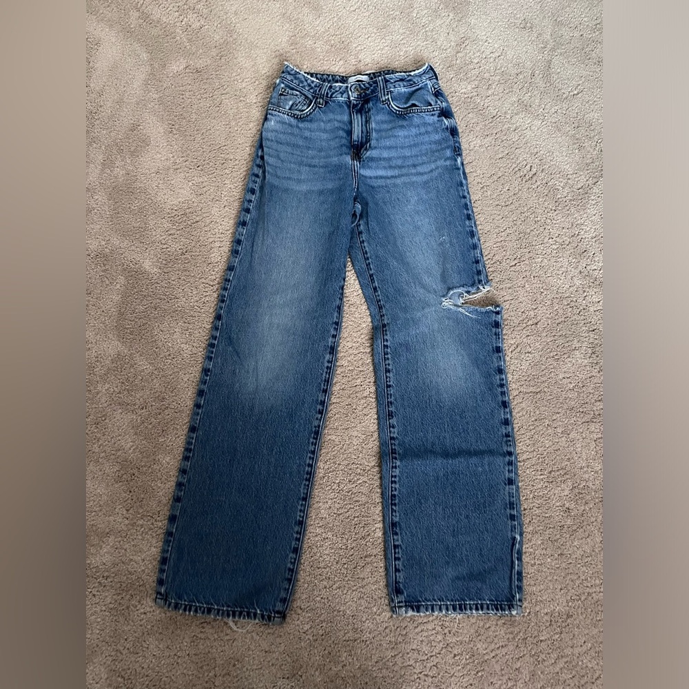 Women’s mid-rise side rip jeans